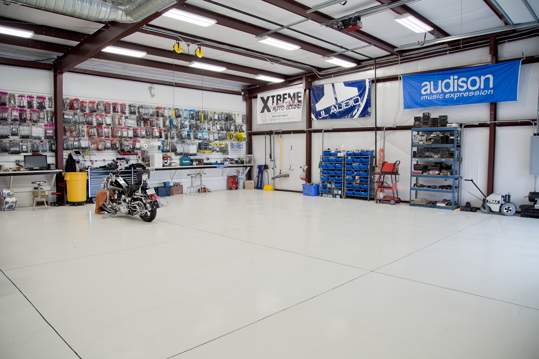 Open shop floor with motorcycle and audio accessories